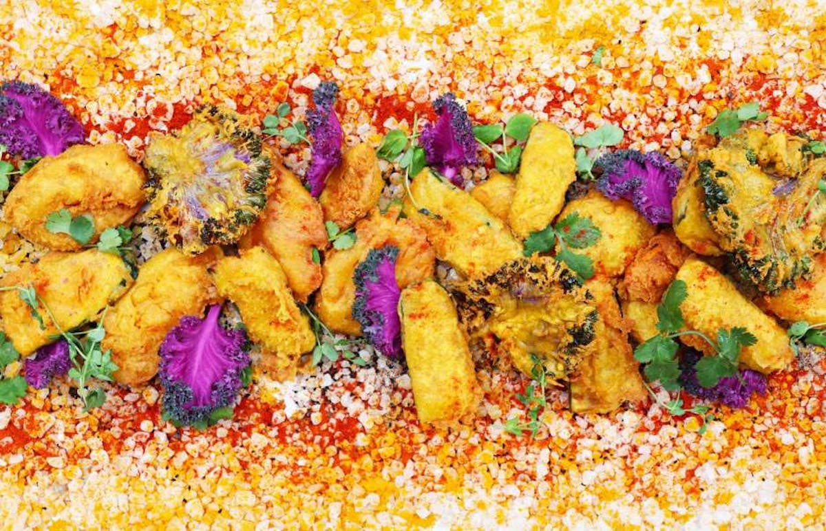 a dish is filled with colorful flowers