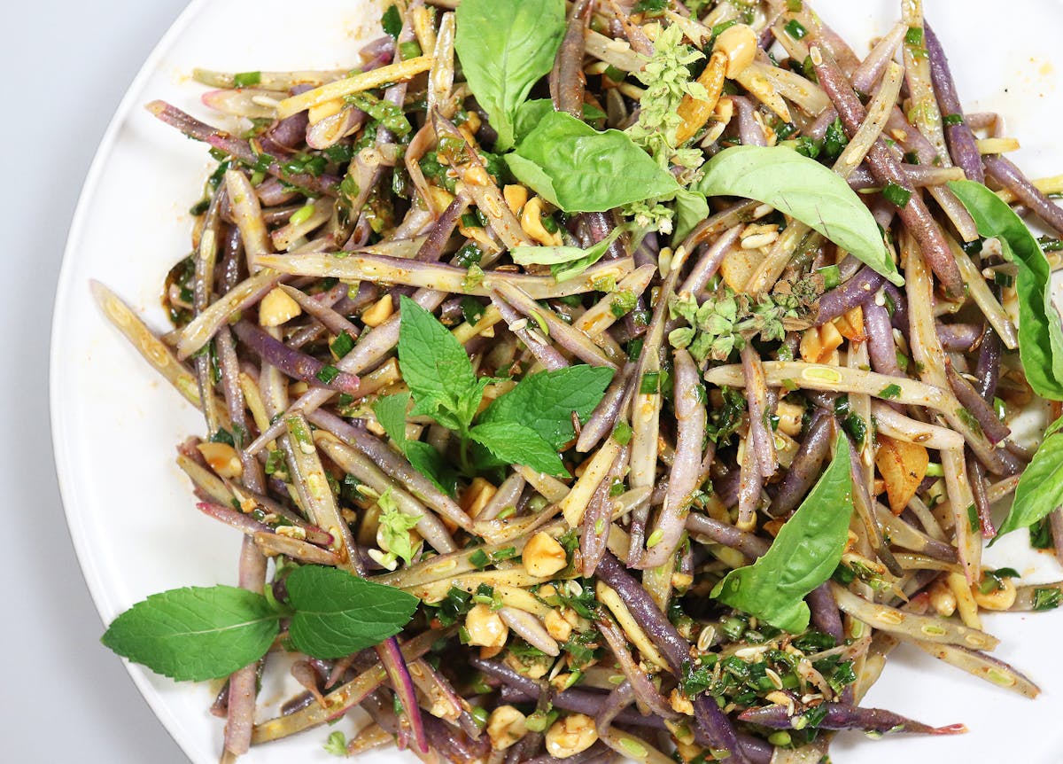 a plate of food with a green salad