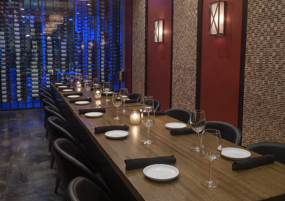 a table topped with a blue chair