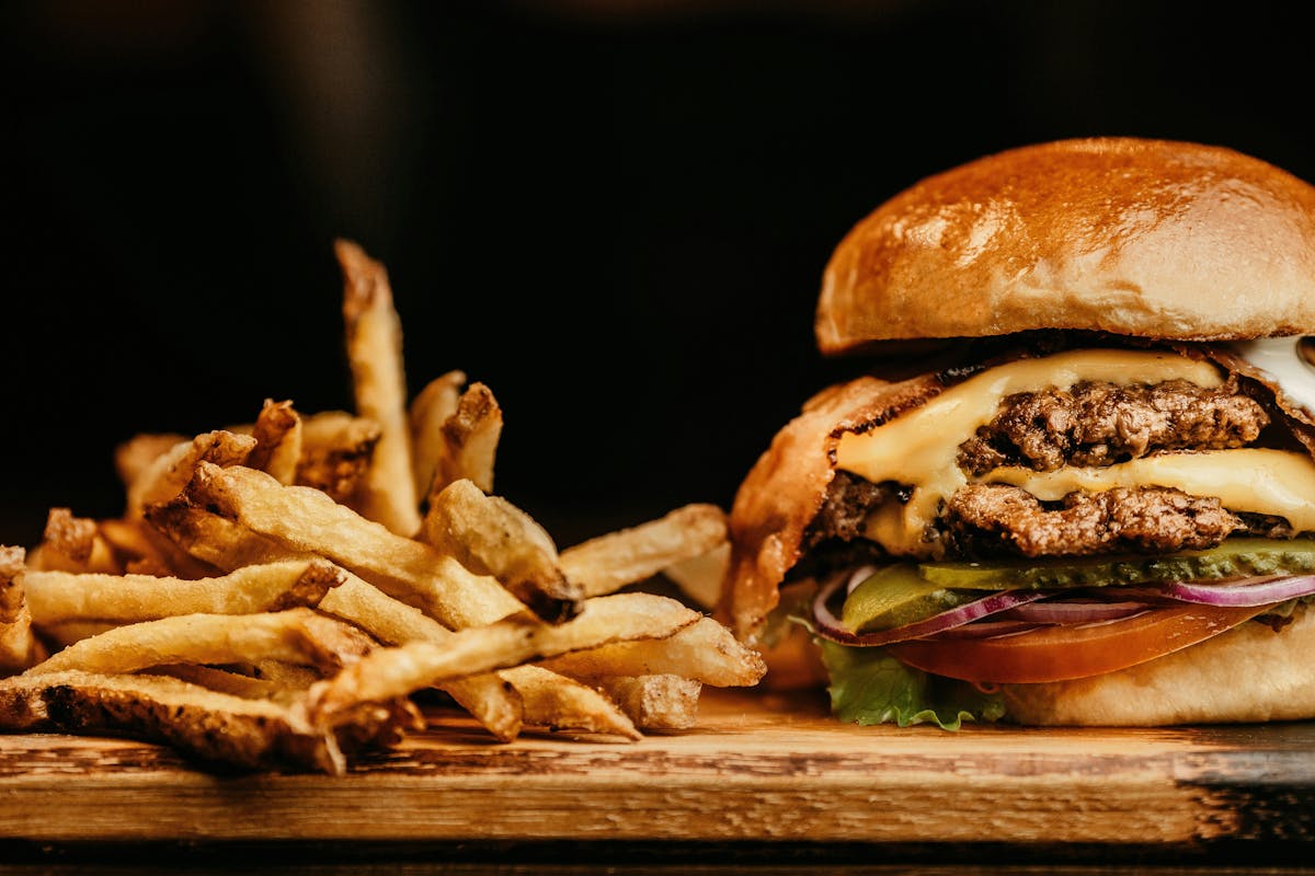 a close up of a sandwich and fries