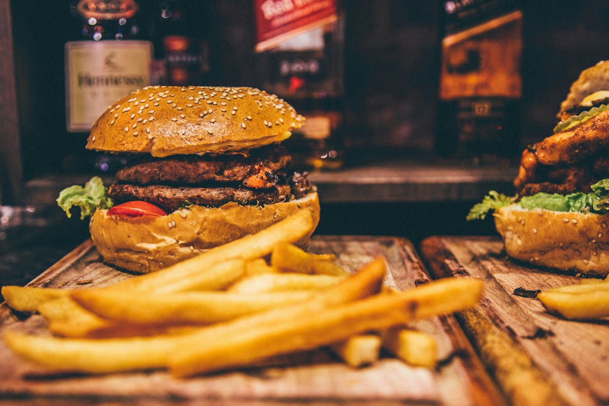 a close up of a sandwich sitting on top of a wooden table