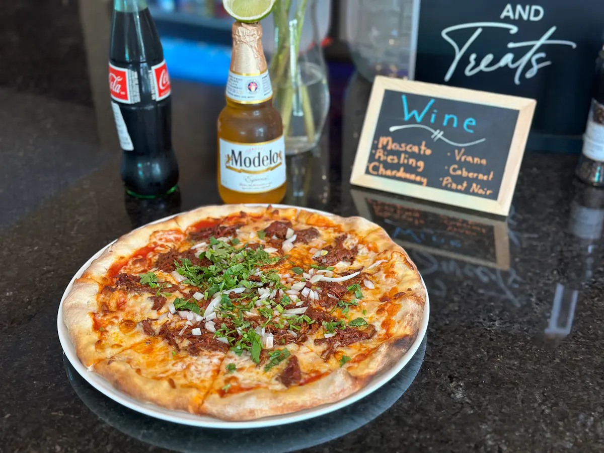 a pizza sitting on top of a table
