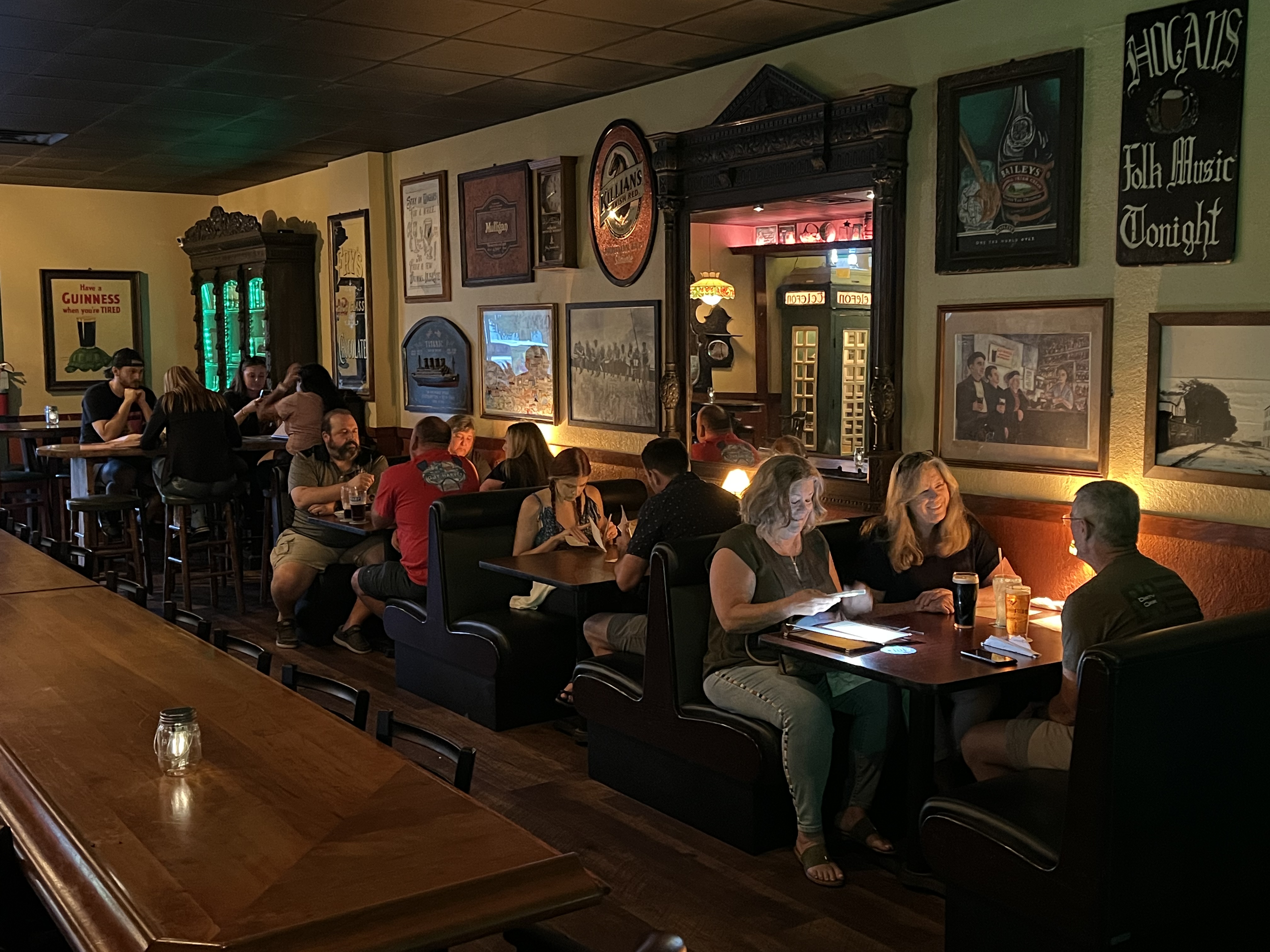 a group of people sitting at a table in a restaurant