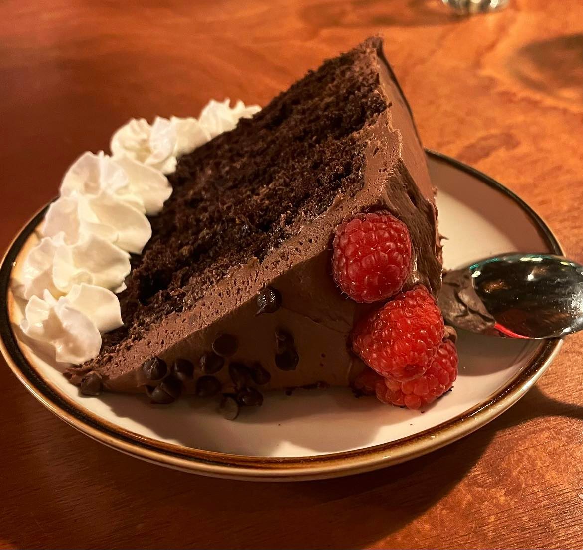 a piece of cake and ice cream on a plate