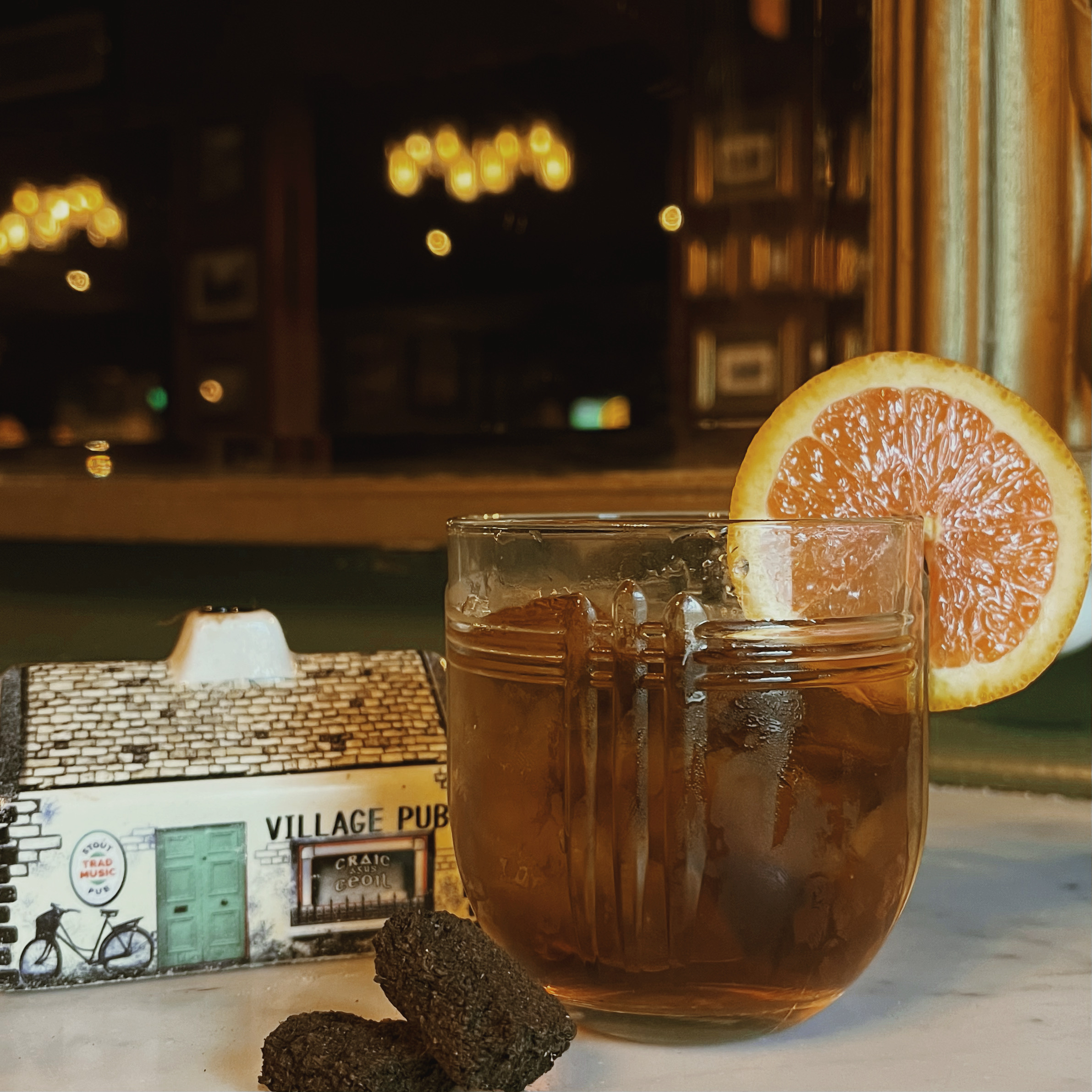 a glass of beer on a table