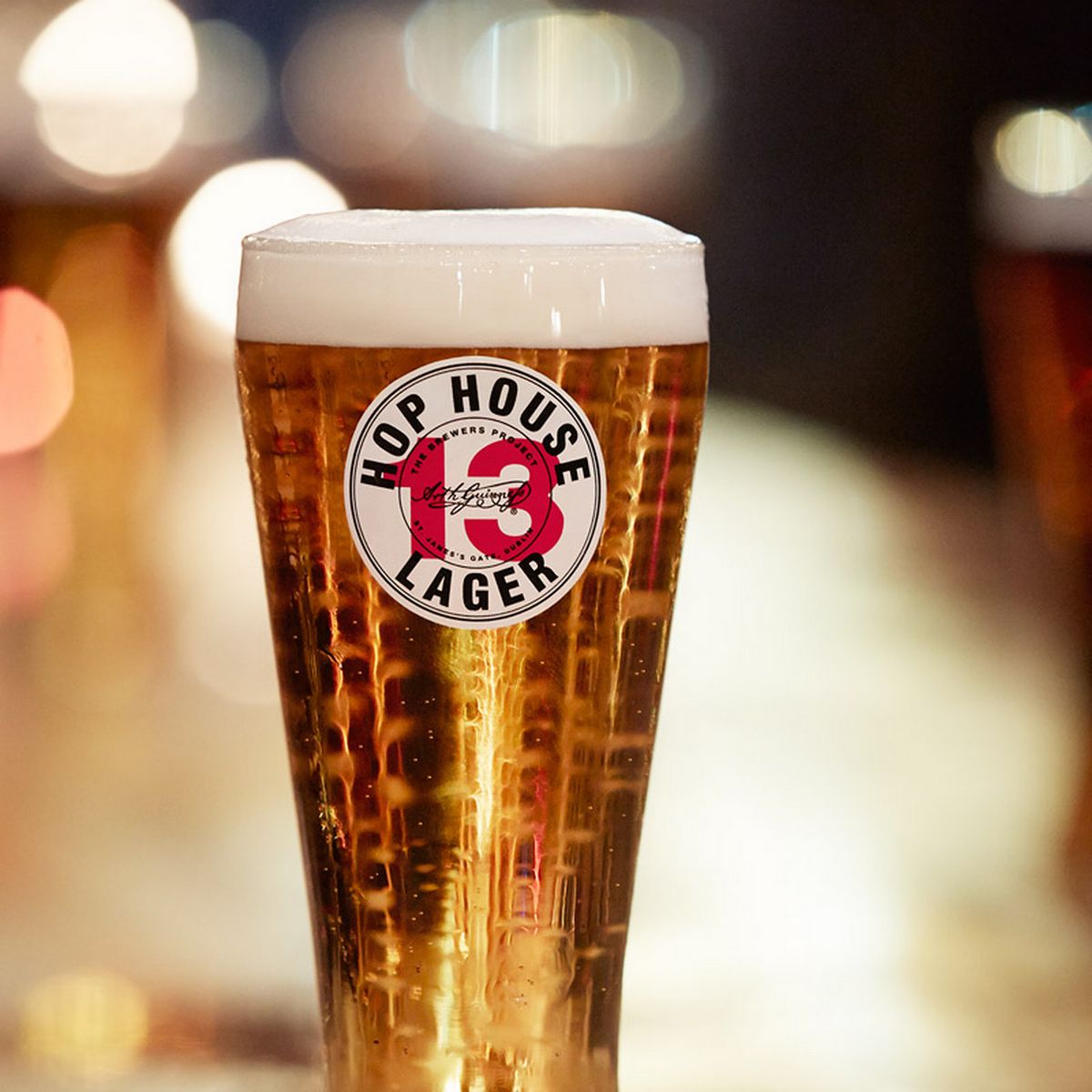 a close up of a glass of beer on a table