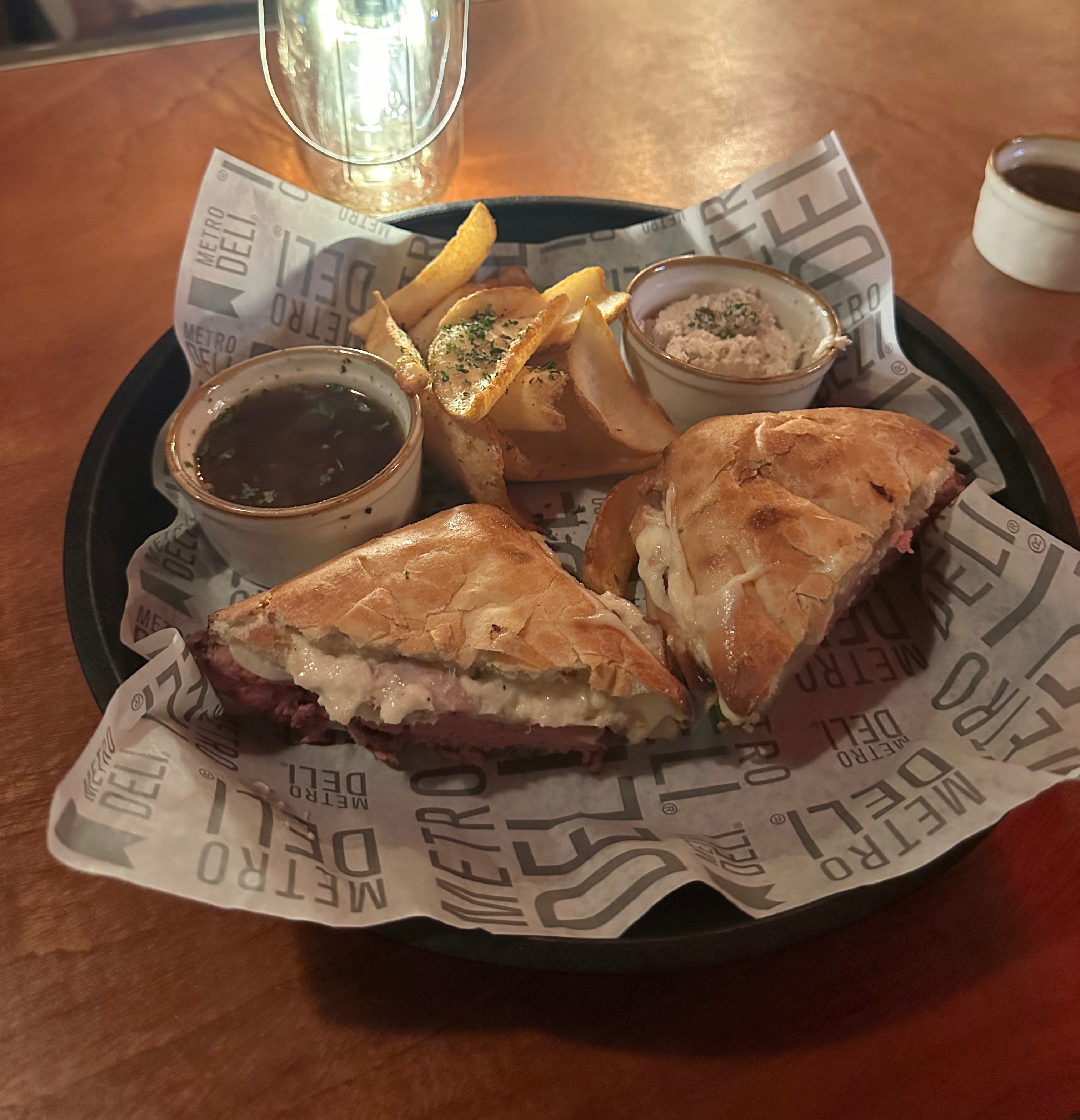 a sandwich sitting on top of a wooden table