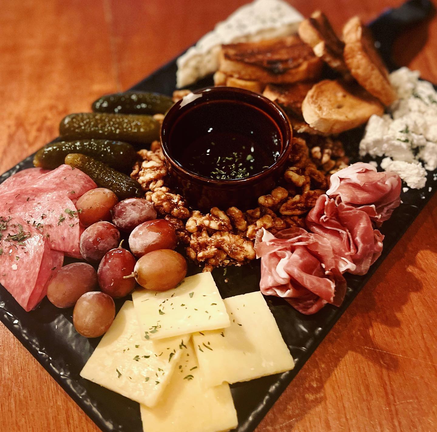 a wooden table topped with different types of food
