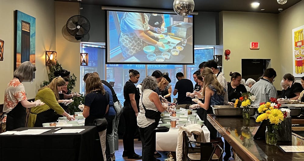 a group of people sitting at a table