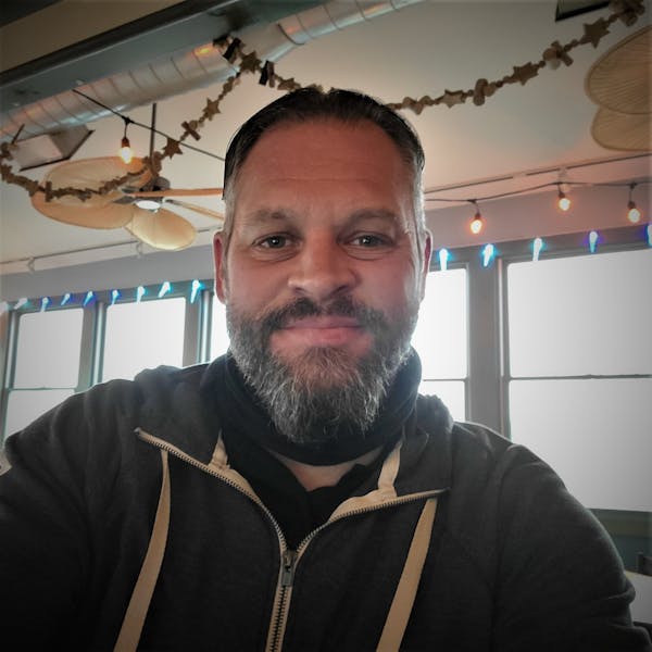 a man smiling for the camera