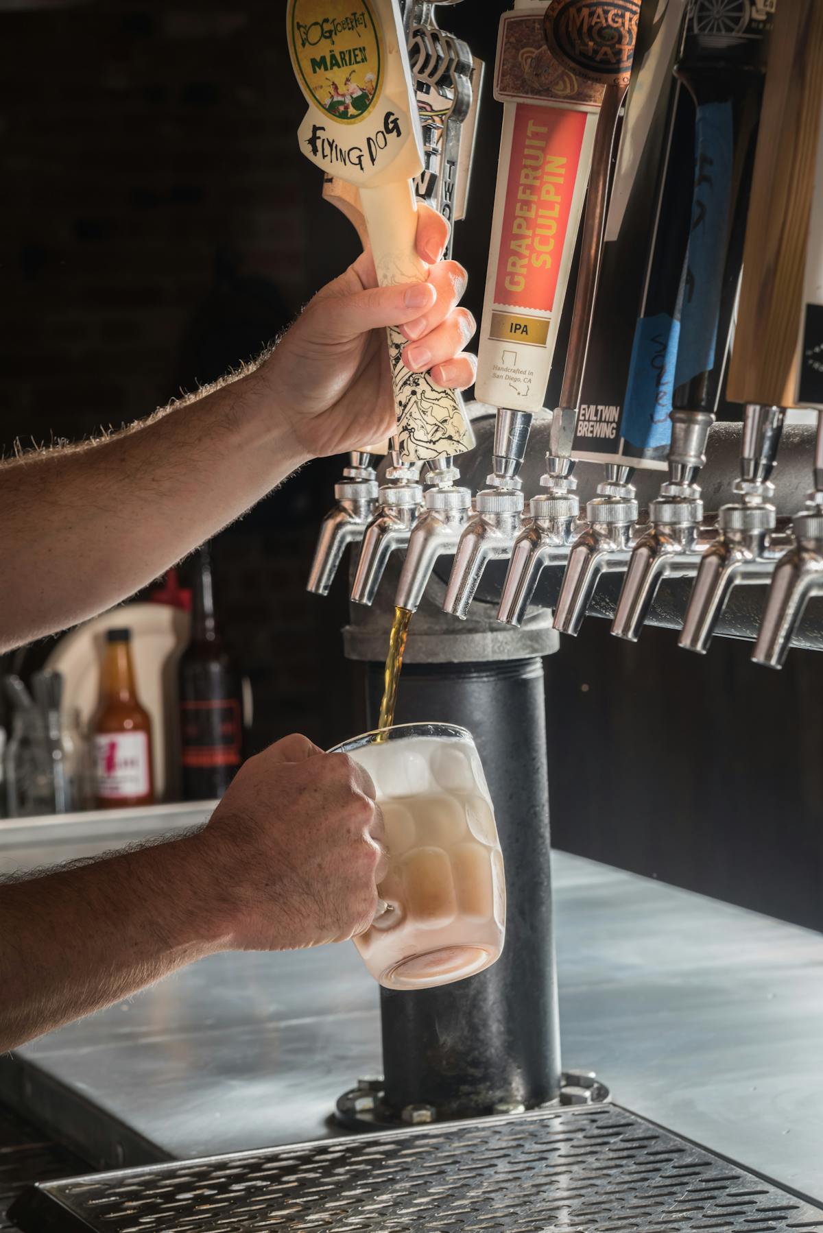 beer being poured from tap