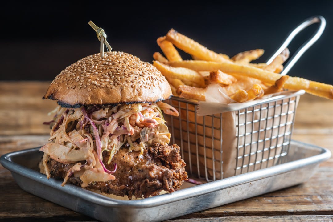 a sandwich sitting on top of a plate of food