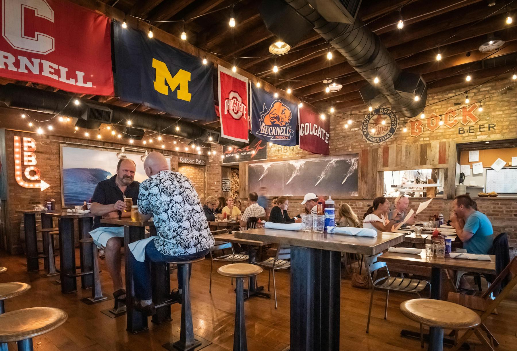 a group of people sitting at a table in a restaurant