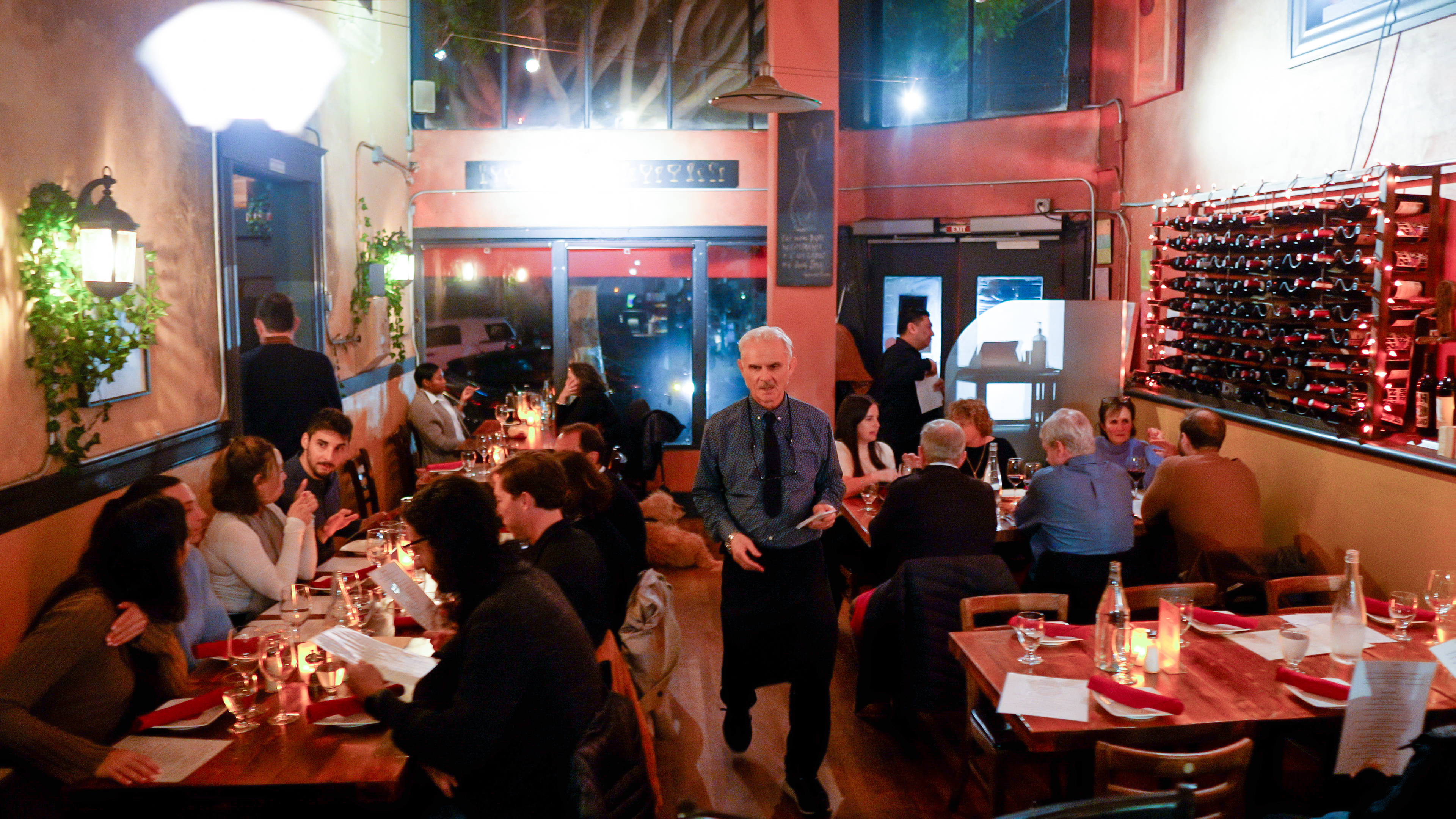 a group of people sitting at a table in a restaurant