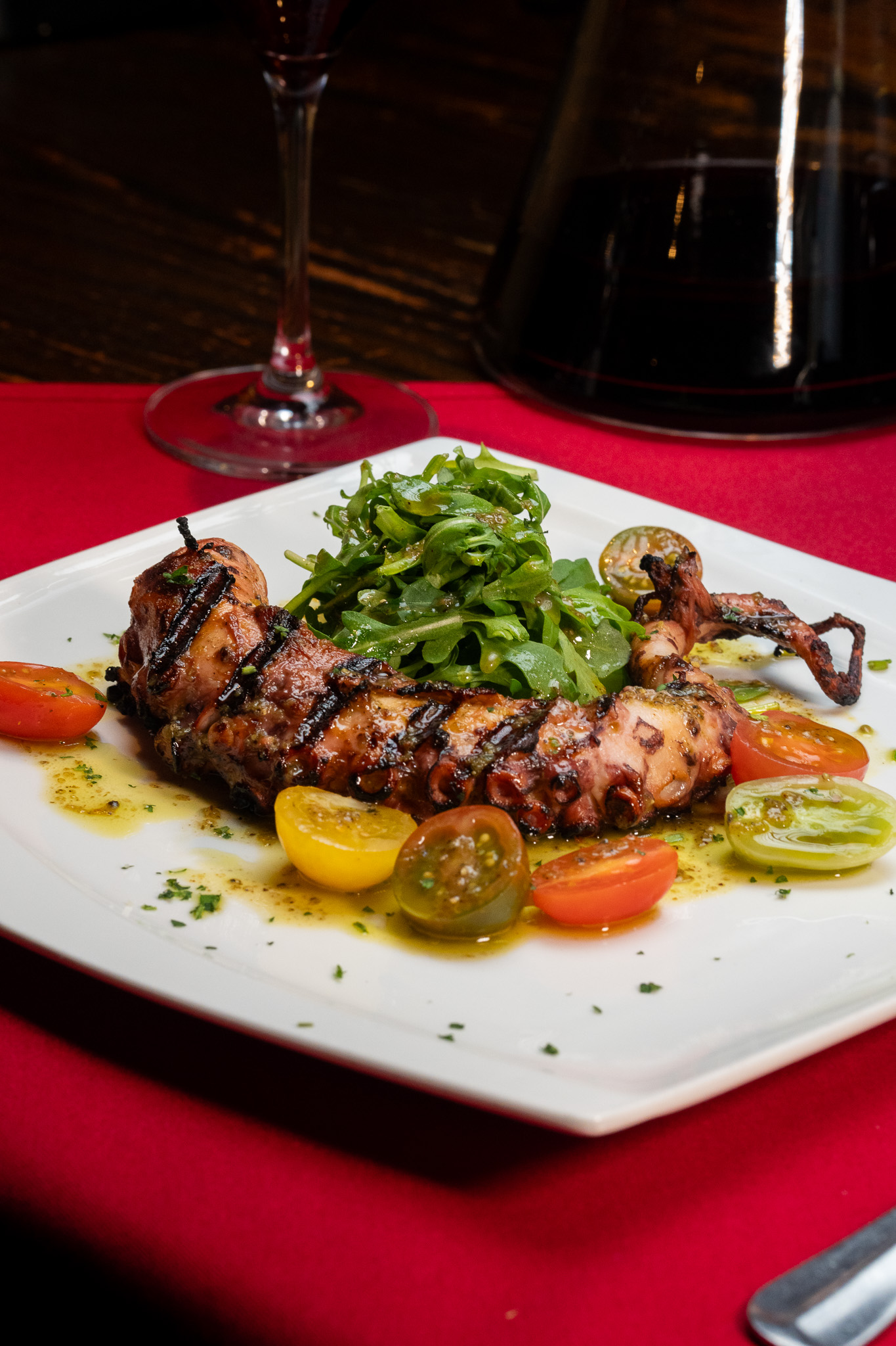 a plate of food and a glass of wine