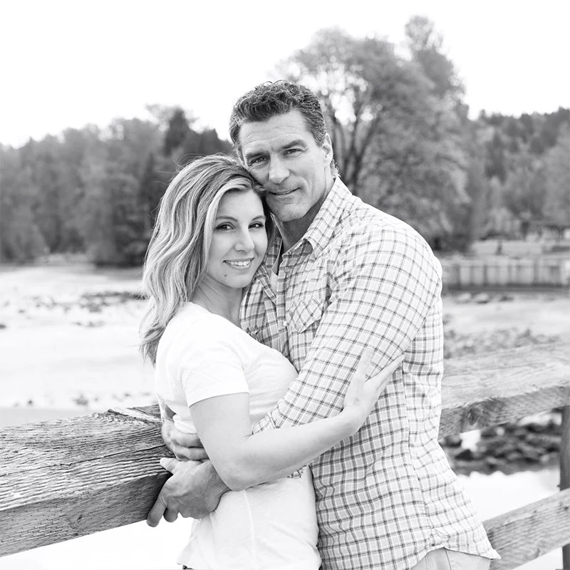 a man and a woman sitting on a bench