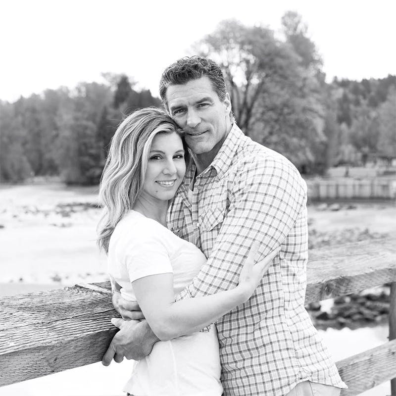 a man and a woman sitting on a bench