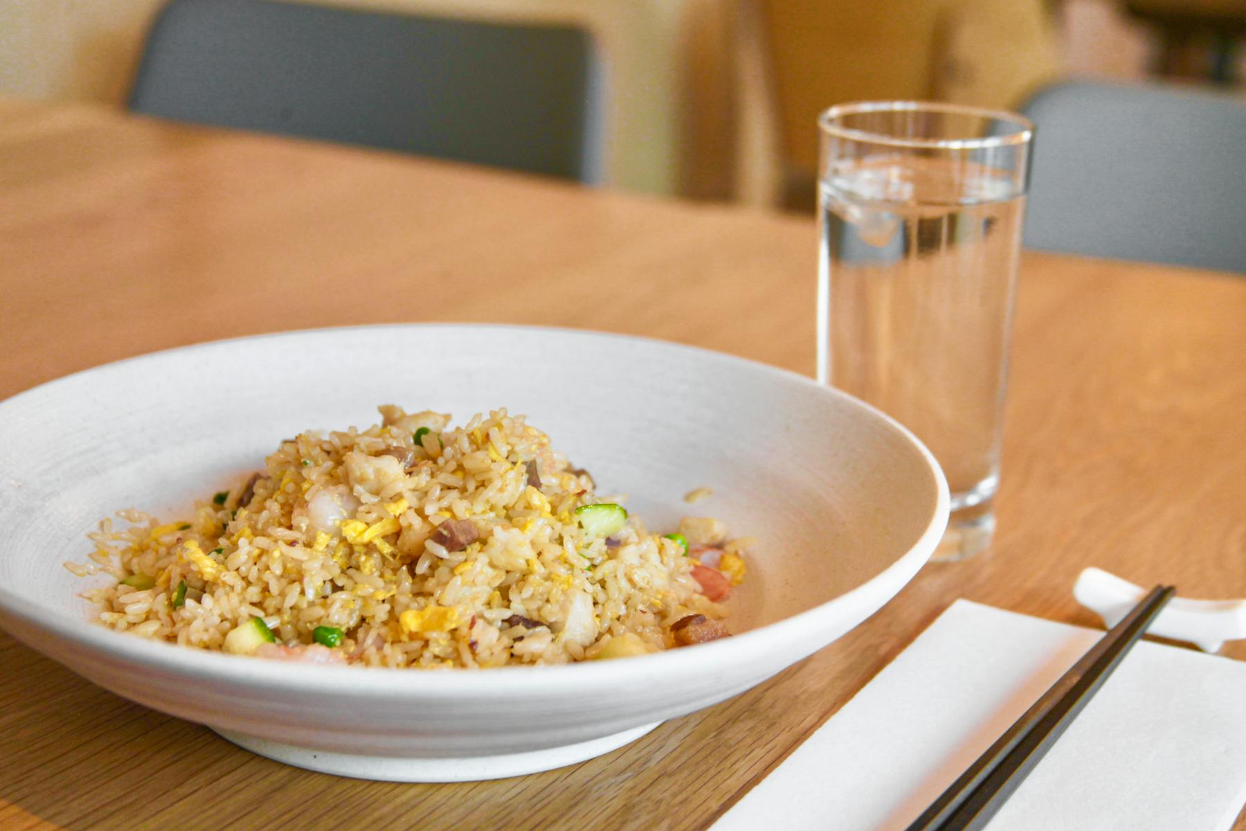 a bowl of food on a plate on a table