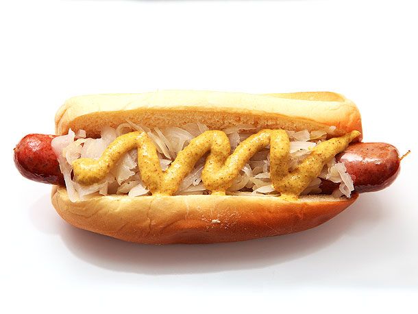 a close up of a hot dog on a bun