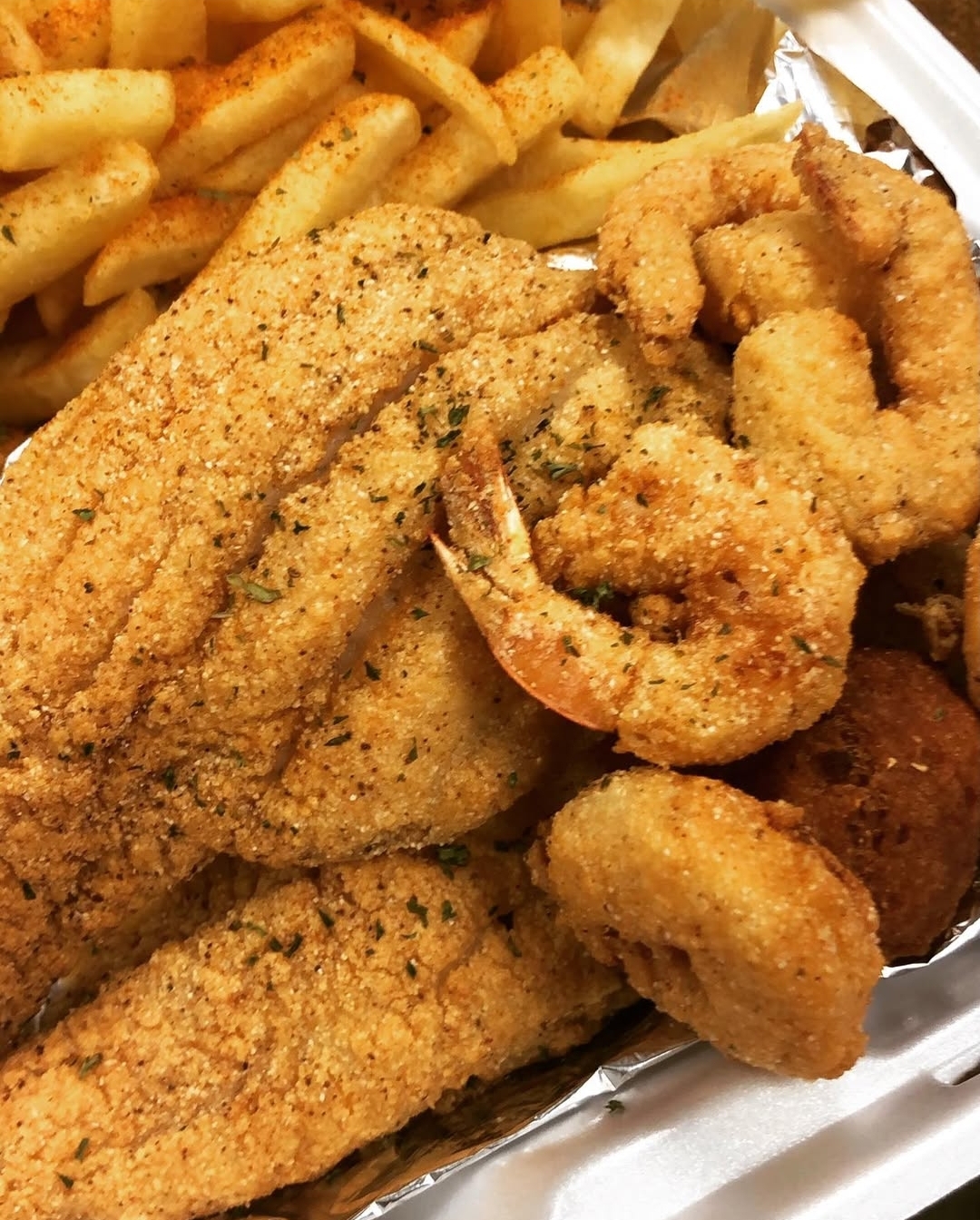 a chicken sandwich and fries on a plate