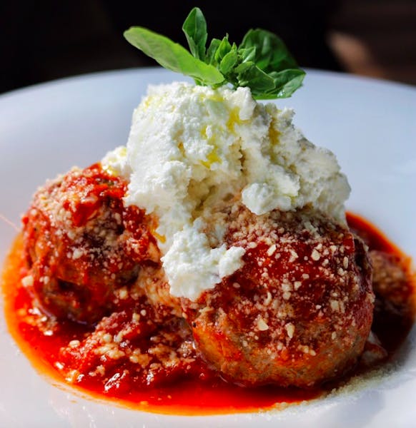 a piece of meat on a white plate