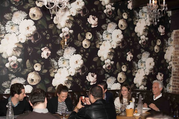a group of people sitting at a table