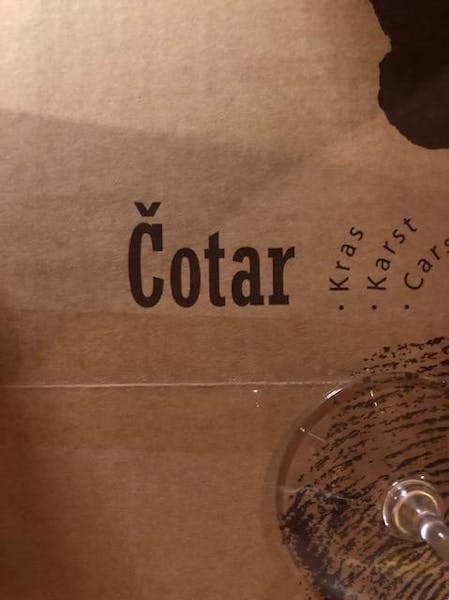 Cotar logo text written on brown paper