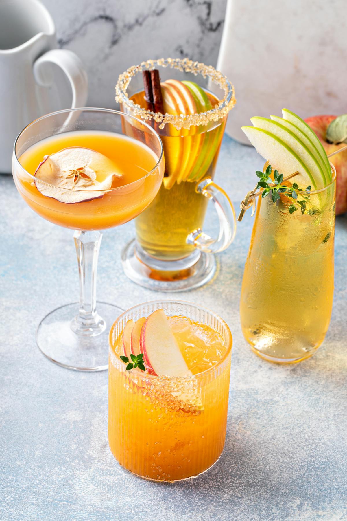 a glass of orange juice next to a cup of coffee
