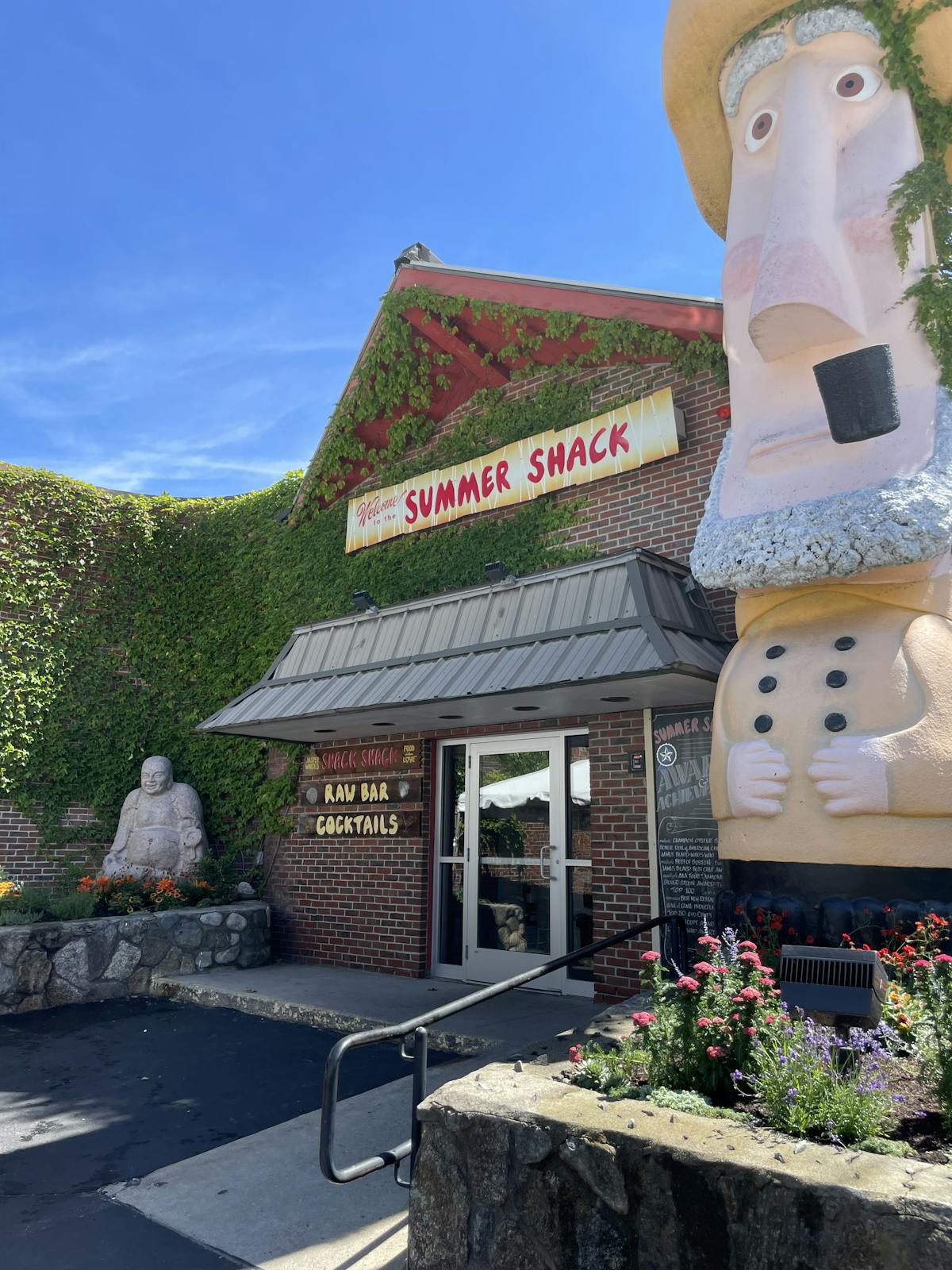 a statue in front of a building