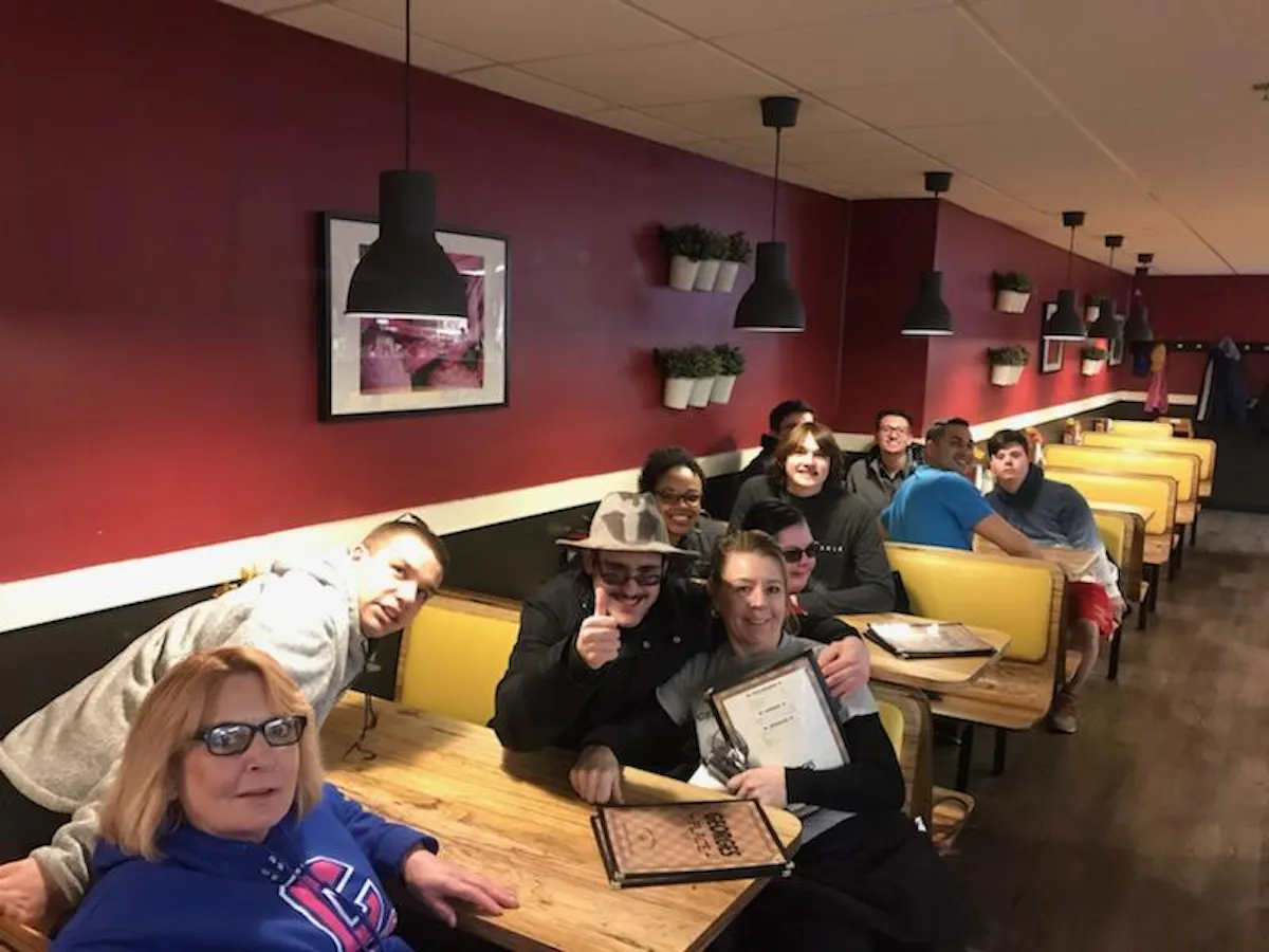 a group of people sitting at a table