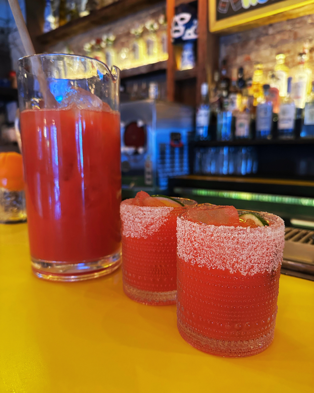 margarita in glasses and pitcher