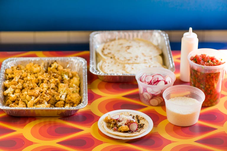 a table topped with plates of food on a plate