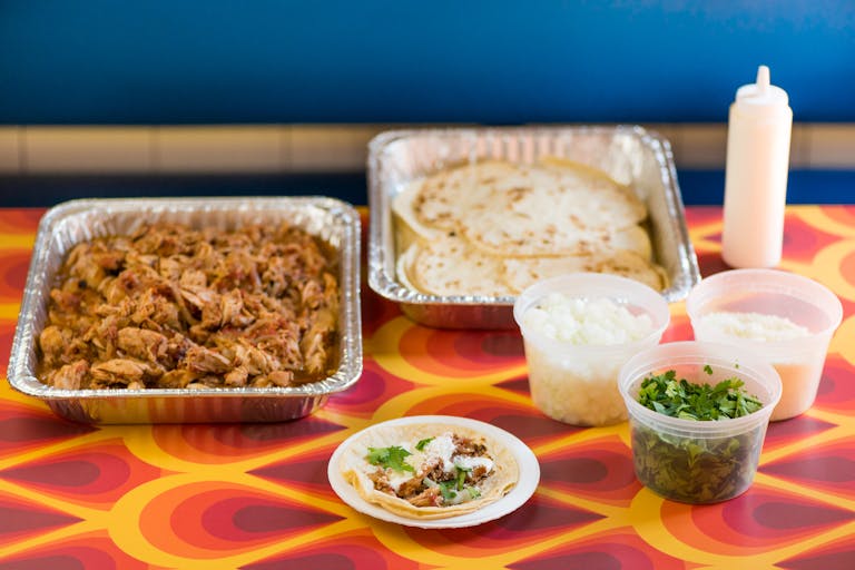 a tray of food on a plate on a table