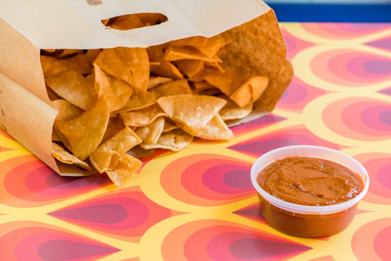 a table topped with a sandwich and fries on a plate