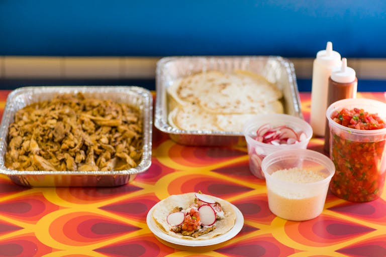 a table topped with plates of food on a plate