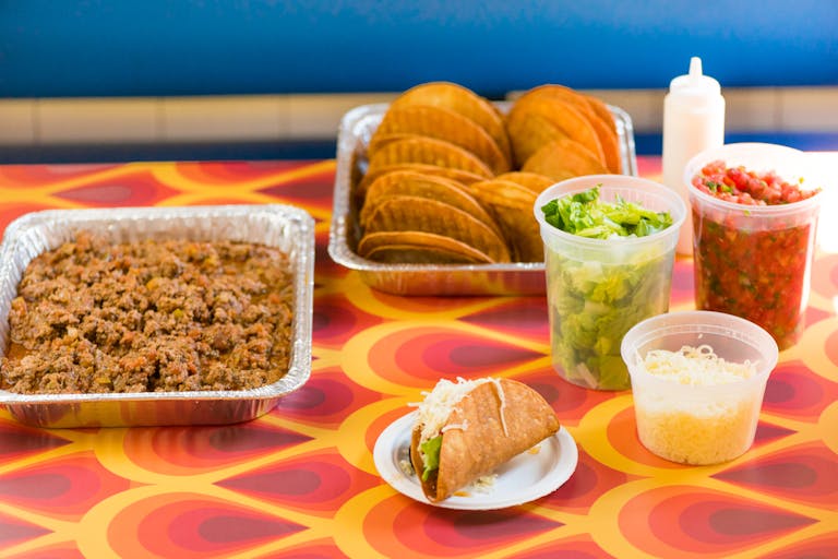 a plate of food and a cup of coffee on a table