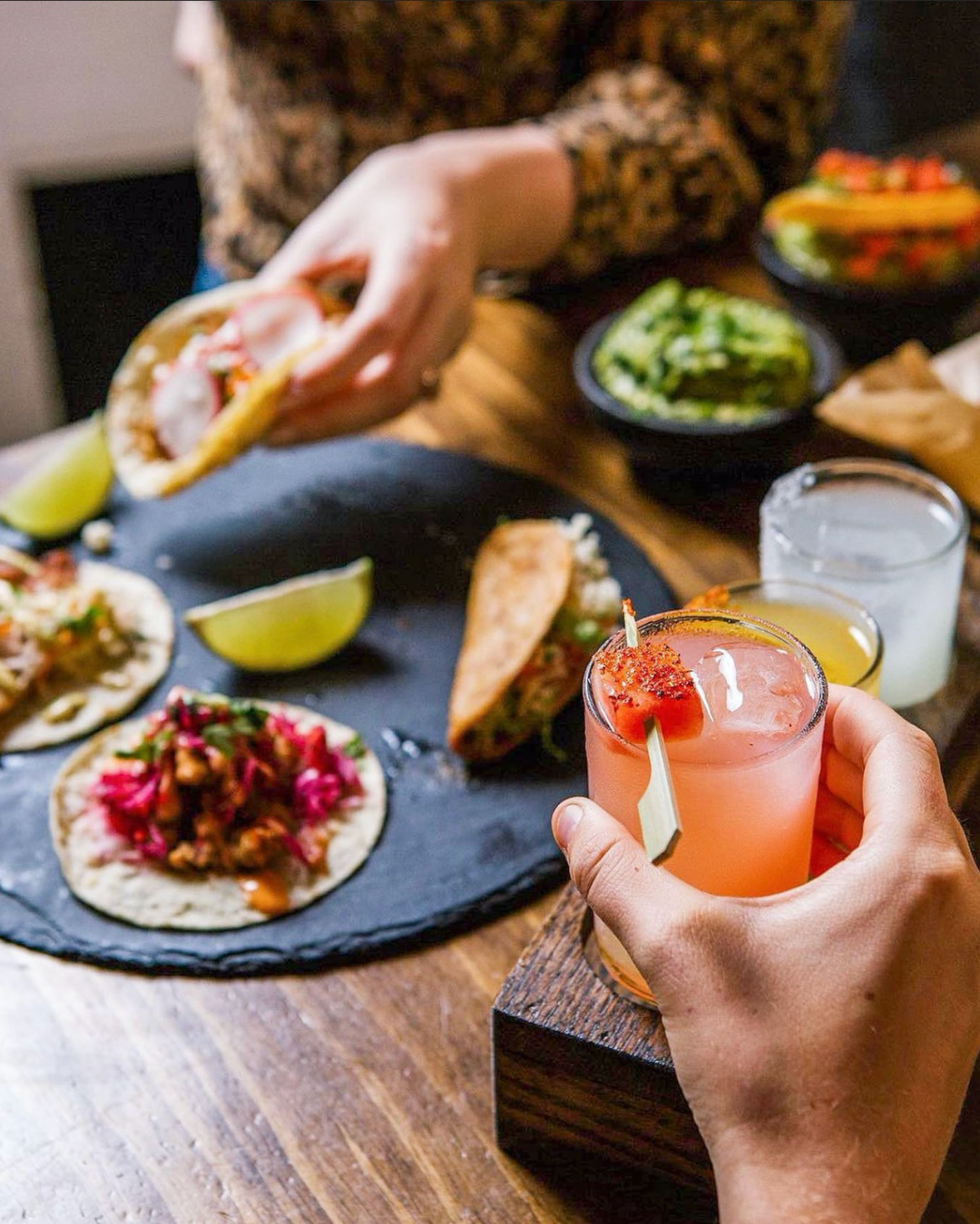 cocktails and tacos on a table