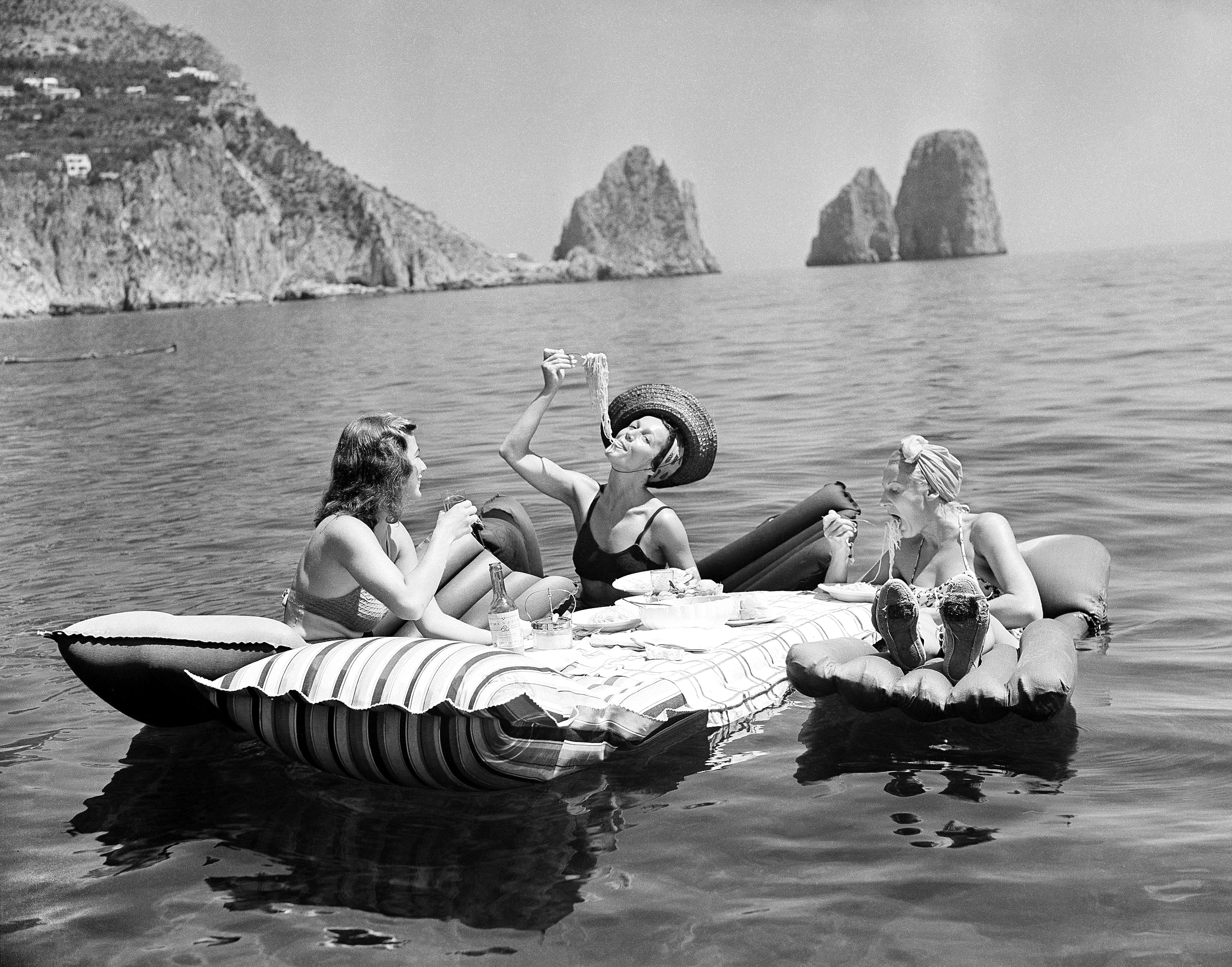 a person sitting on a boat in the water