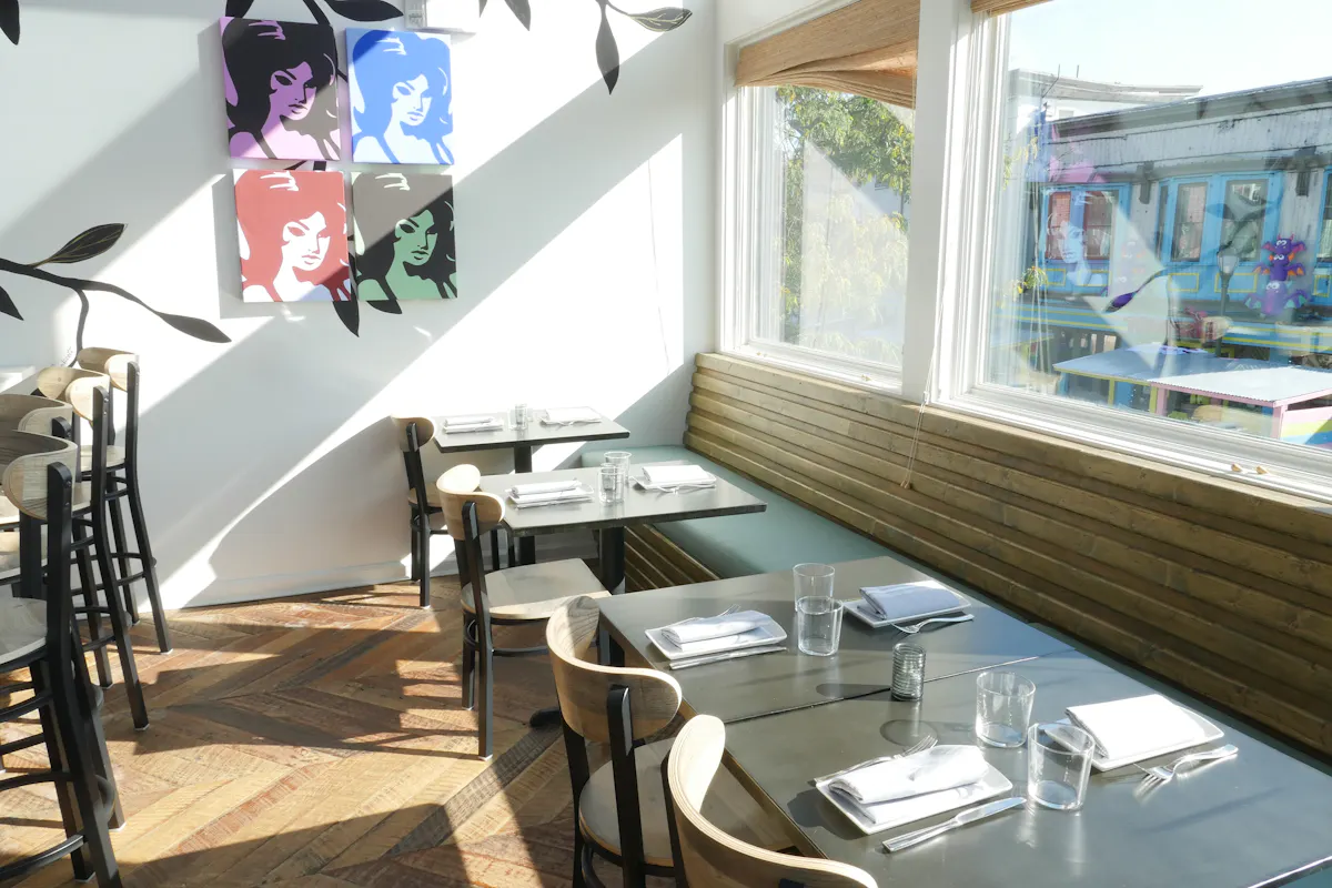 a dining room table in front of a window