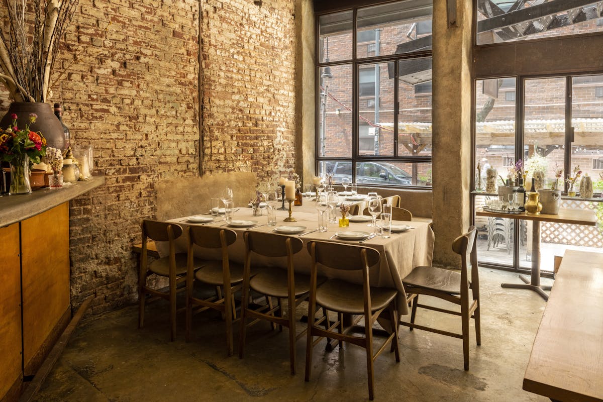 a dining room table in front of a window