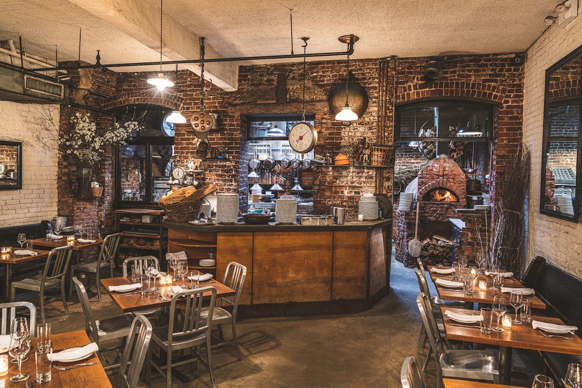 a living room filled with furniture and a fire place