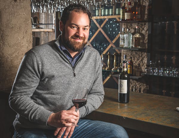 a man holding a wine glass