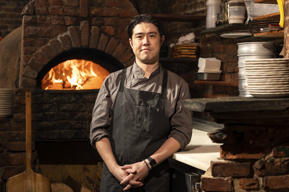 a man cooking on a grill