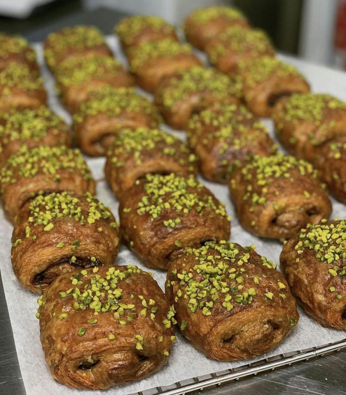 a close up of a tray of croissants