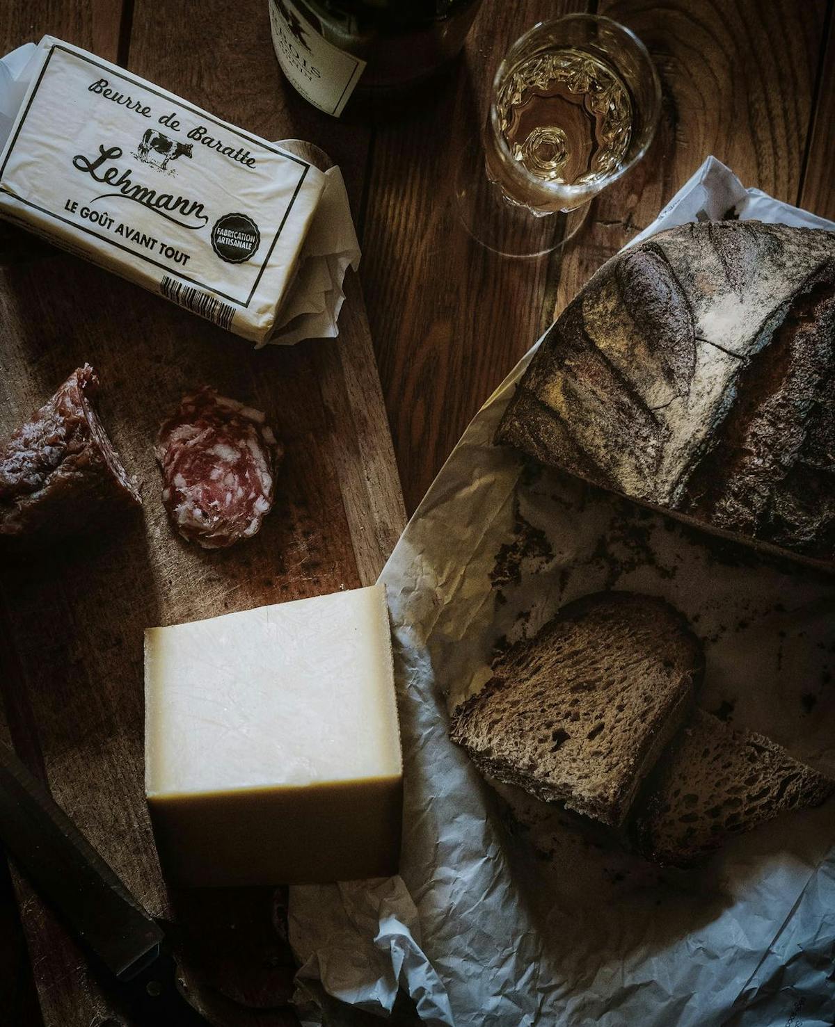 cheese and bread on a wooden table