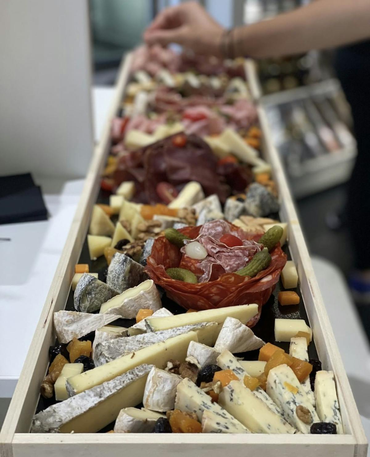 a box filled with different types of charcuterie