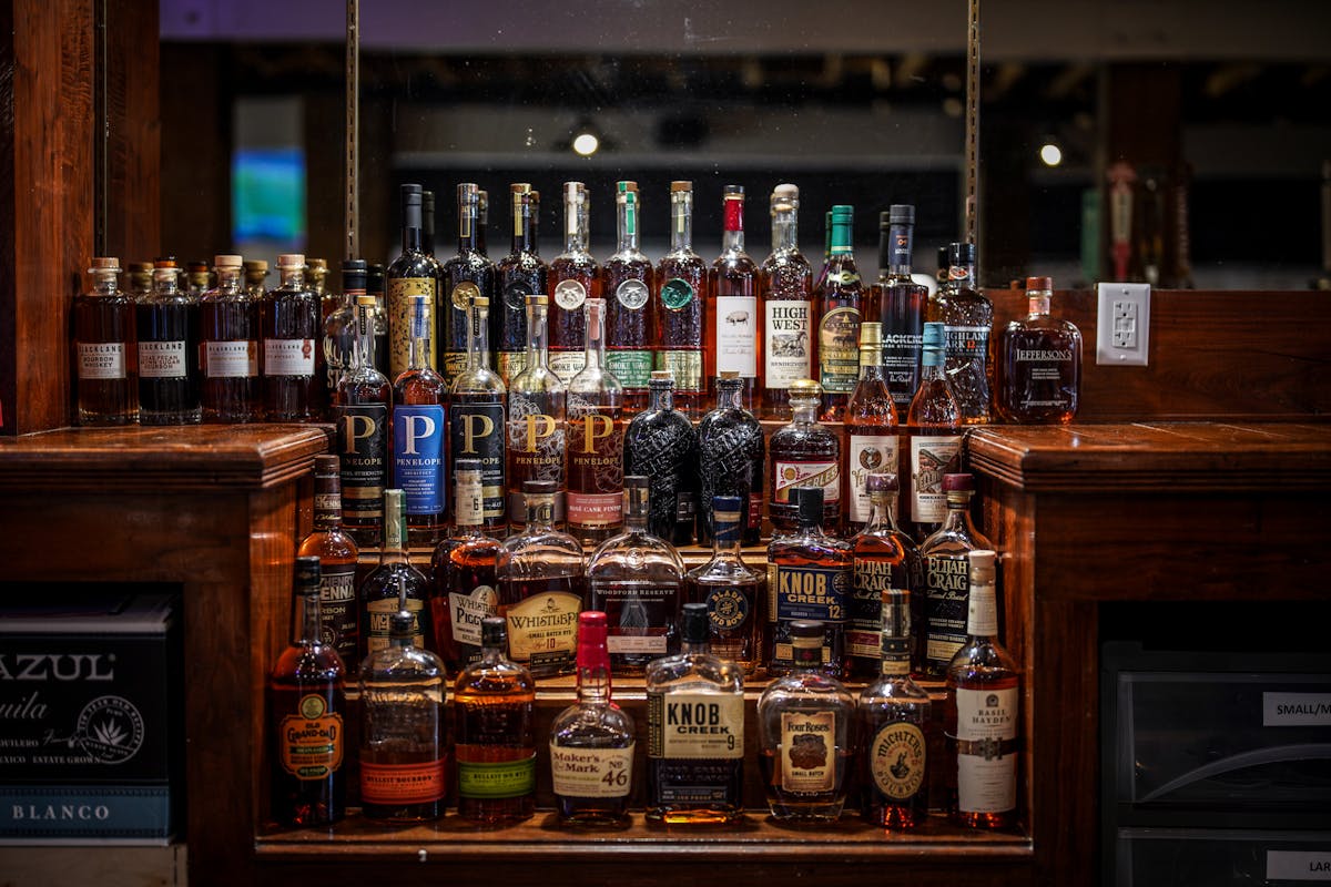 a bottle of wine and a glass display case