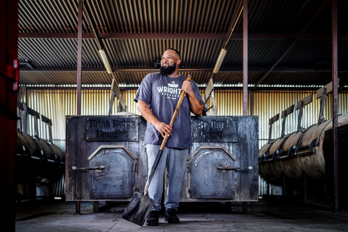 a man standing in front of a building