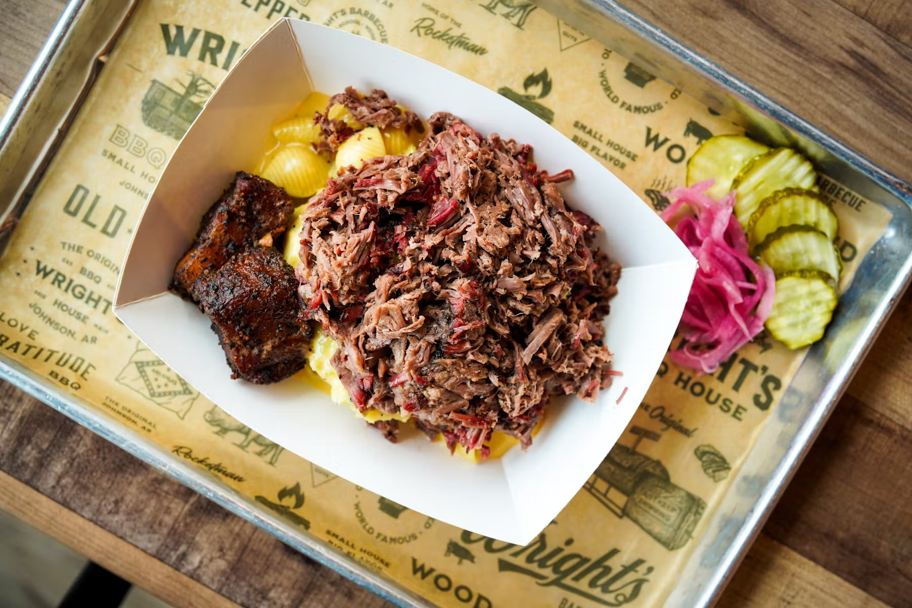 a plate of food sitting on top of a wooden table