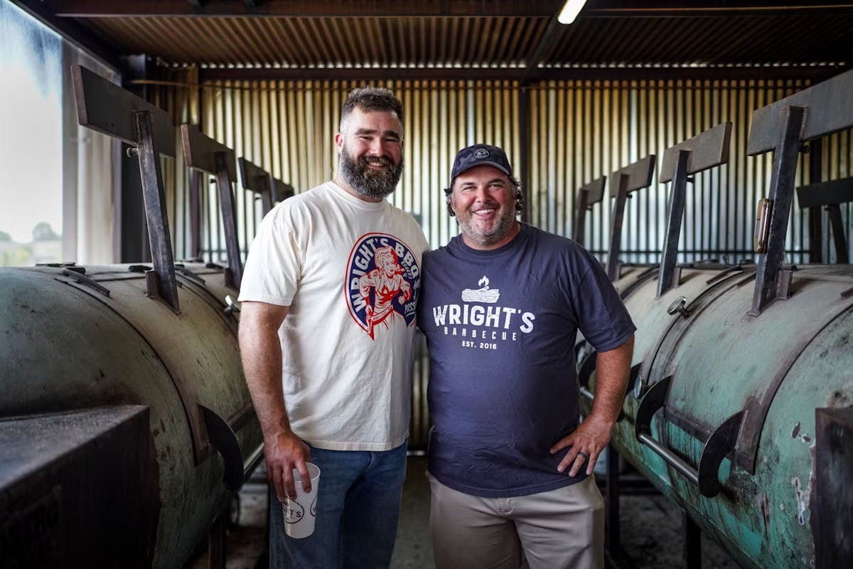 Jason Kelce standing in front of a barrel